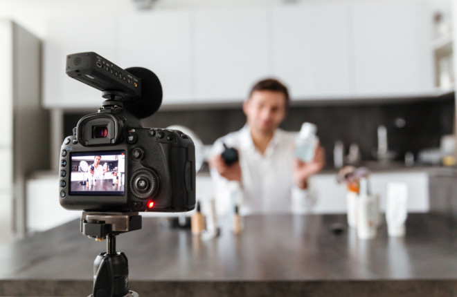 Handsome young man filming his video prospecting